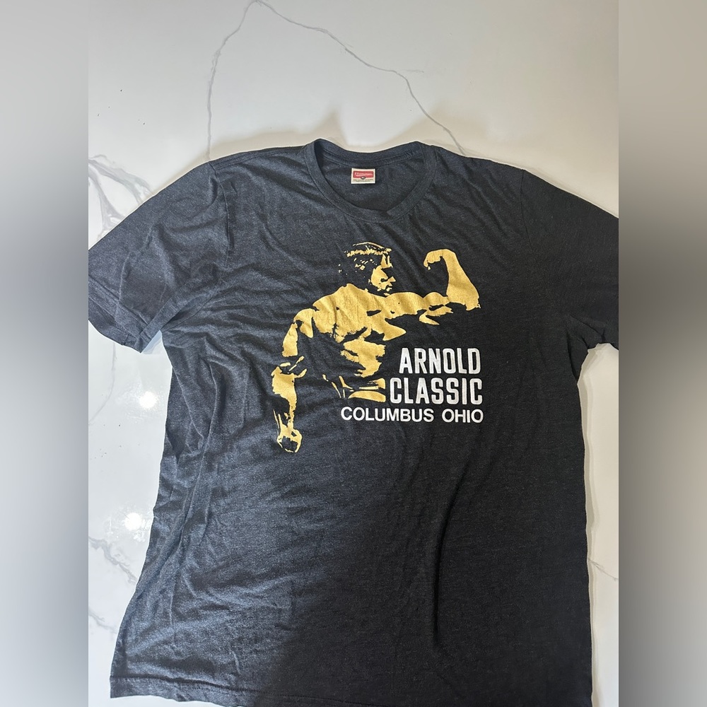 HOMAGE Black Tee with Gold Arnold Classic Graphic